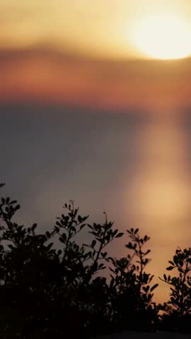  Vertical Shot of Gentle Focus Pull Revealing a Beautiful Ocean Sunset in 4K Ultra HD | Tranquil Sea