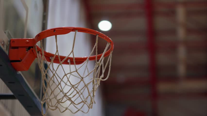 Low Angle Shot of Basketball Falling Through Hoop – Scoring Point in Slow Motion 4K Ultra HD