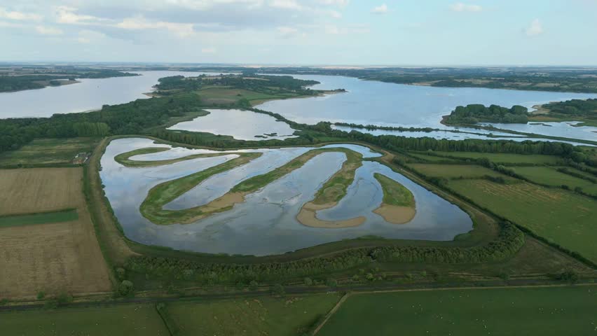Aerial drone shot of Rutland Water reservoir, Nature wetland reserve for birds and fish in England UK