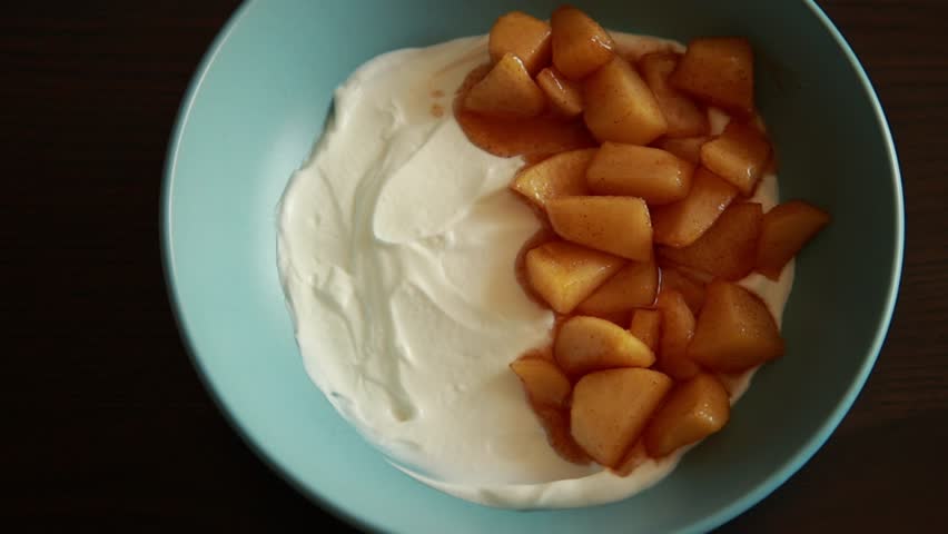 healthy autumn breakfast bowl yogurt granola and apple close up