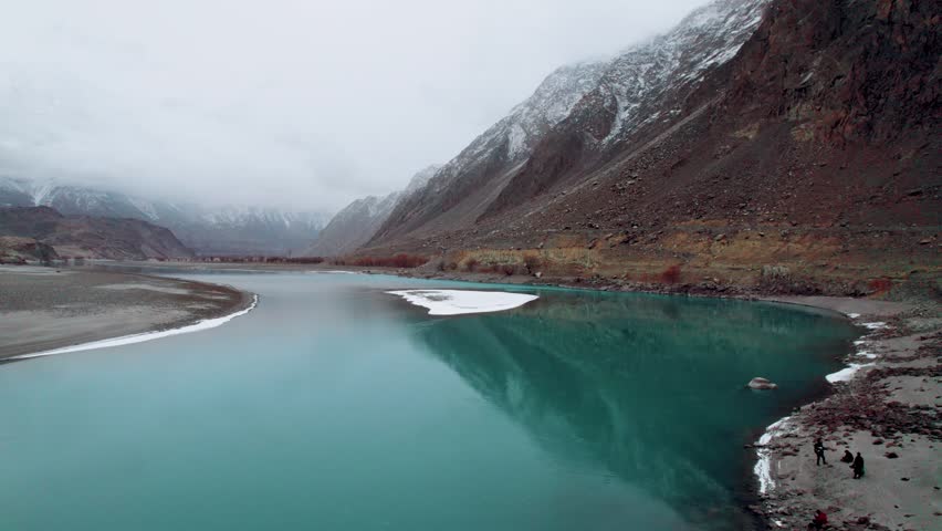 Beautiful drone view of lake in Gilgit Baltistan, Pakistan. Beautiful lake, blue water, rock mountains, trees, travelling, nature, spa, beauty, Northern area of Pakistan, beautiful valley.