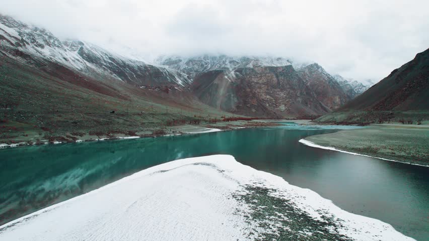 Beautiful drone view of lake in Gilgit Baltistan, Pakistan. Beautiful lake, blue water, rock mountains, trees, travelling, nature, spa, beauty, Northern area of Pakistan, beautiful valley.