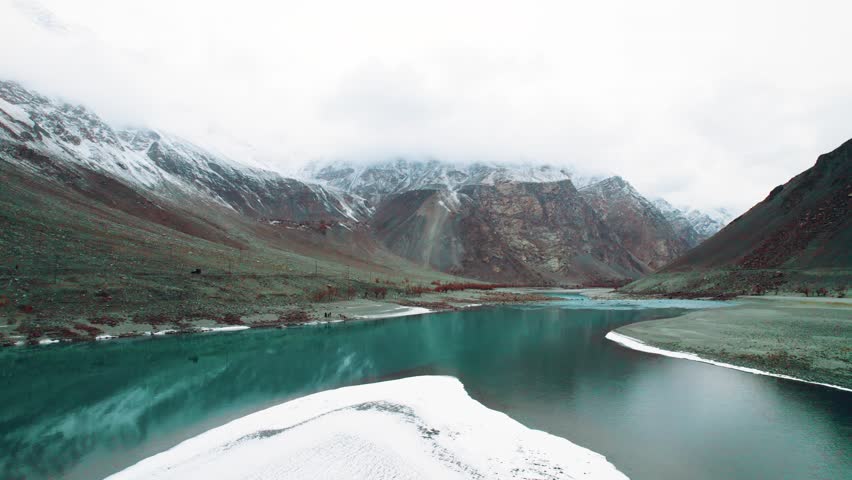 Beautiful drone view of lake in Gilgit Baltistan, Pakistan. Beautiful lake, blue water, rock mountains, trees, travelling, nature, spa, beauty, Northern area of Pakistan, beautiful valley.