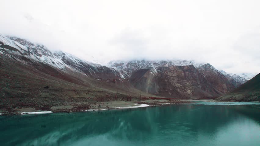 Beautiful drone view of lake in Gilgit Baltistan, Pakistan. Beautiful lake, blue water, rock mountains, trees, travelling, nature, spa, beauty, Northern area of Pakistan, beautiful valley.