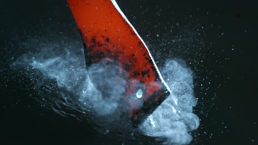 Blacksmith puts the red-hot forged metal part into the water . Super slow motion filmed on high speed cinematic camera at 1000 fps