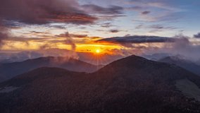Golden Sunrise Over Mountains with Fast Moving Clouds, Nature Timelapse - Powered by Shutterstock - Get 15% off with code: PIKWIZARD15