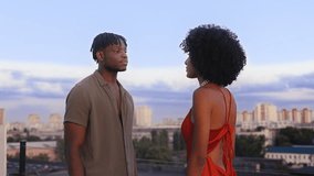 Unhappy African American couple arguing on rooftop, relationship crisis - Powered by Shutterstock - Get 15% off with code: PIKWIZARD15