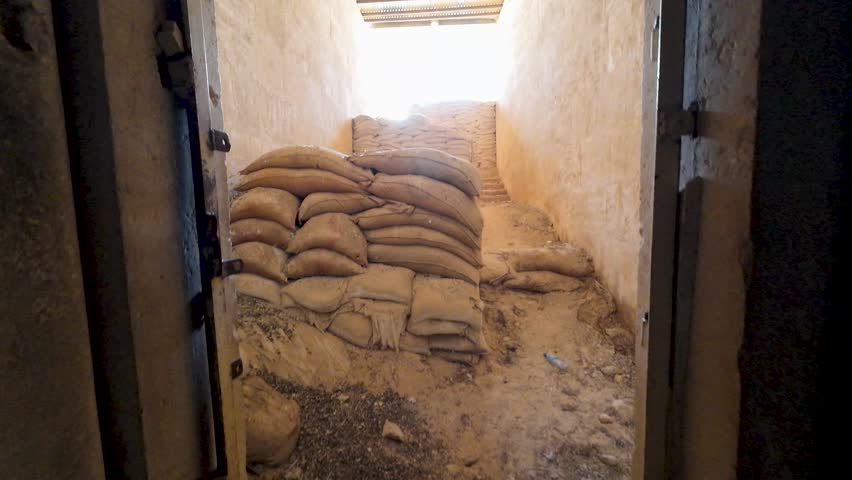 Stone staircase with sandbags in an ancient building. Former ISIS secret military base. Syria, Palmyra.