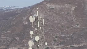 Aerial view of telecommunication towers and antennas on Paros Island, Cyclades, Greece. Symbol of modern technology, wireless communication, and infrastructure with scenic background. - Powered by Shutterstock - Get 15% off with code: PIKWIZARD15