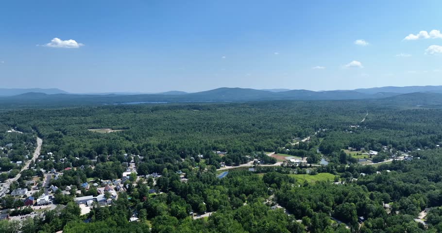Aerial view of Conway, New Hampshire against the beautiful summer mountains