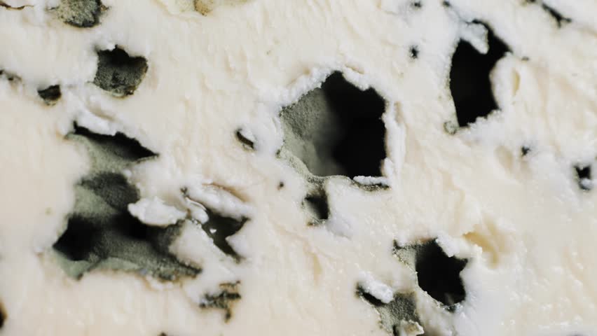 Aromatic blue cheeses with a noble mold. The texture of the blue cheese.