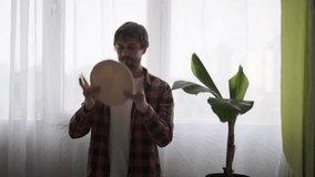 Funny man tossing pizza dough in kitchen. Homemade pizza, cooking at home - Powered by Shutterstock - Get 15% off with code: PIKWIZARD15