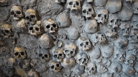 Skulls embedded in a wall, Liguria, Italy, evoke mystery and history - Powered by Shutterstock - Get 15% off with code: PIKWIZARD15