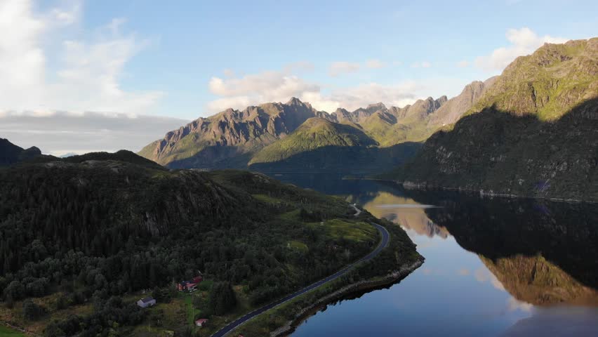 Scenic 4K aerial drone footage of Lofoten in Northern Norway, filmed on August 28, 2025. The clip shows dramatic fjord landscape, steep mountains, and bright summer light. Perfect for themes related 