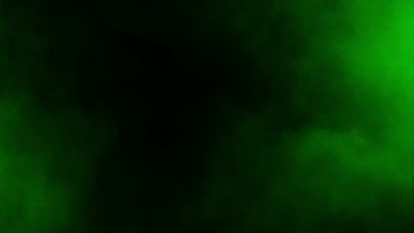 Realistic green smoke mist or fog drifts and swirls on black background. Ideal for overlays, special effects, and creating a mysterious, toxic, poison, radioactive or magical atmosphere