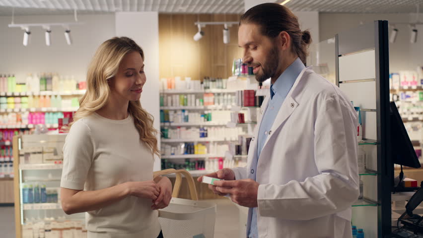 Pharmacist customer talking buying cardiac pills medicine advice therapy pharmacy consultation man woman doctor patient conversation professional assisting vitamins tablets drugs purchase in drugstore