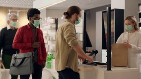 Diverse customers in masks pharmacy drugstore buy antiviral medication covid infection pharmacist woman help clients health care medicine packing order pills drugs vitamins credit card payment shop - Powered by Shutterstock - Get 15% off with code: PIKWIZARD15