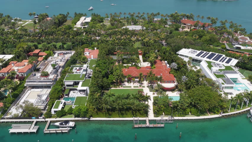 Florida landscape view. Star Island in Miami beach, Florida. Residential buildings in luxury Star island surrounded by sea. Waterfront residential area on Star island, Miami. Private Docks