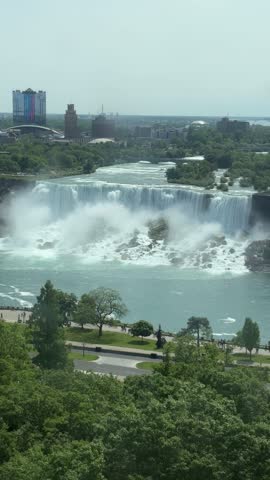 POV shot from an ascending glass viewing elevator, with a view of the American Falls and Bridal Veil Falls in Niagara Falls, Ontario, Canada.