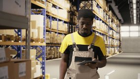 African american man using scanner to register barcodes tags in inventory, solving logistics operations in industrial warehouse. Worker checking shipping labels near storage racks. Camera A. - Powered by Shutterstock - Get 15% off with code: PIKWIZARD15