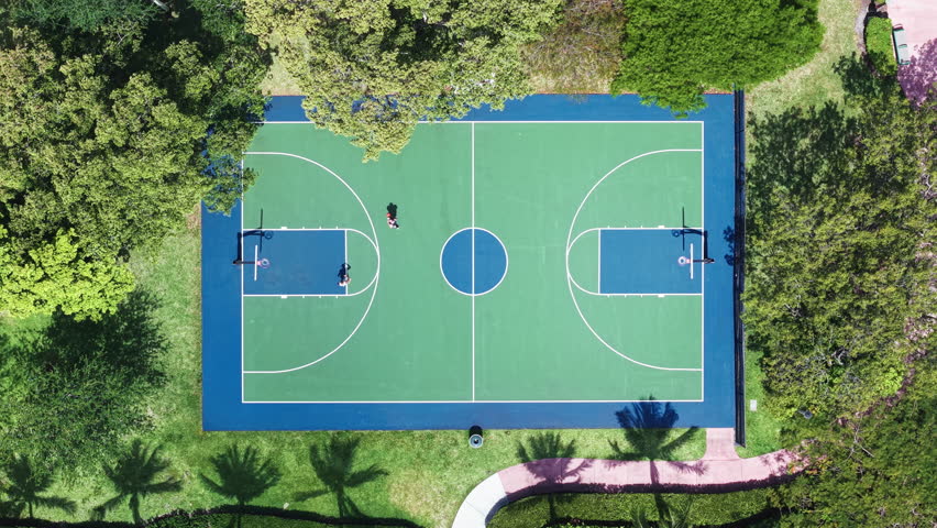 Sport and leisure activity in park. Aerial basketball court field. Sport and hobby. Outdoor basketball field court. Basketball field top aerial view. Sport activity and lifestyle