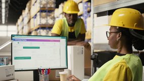 African american female verifying the shipment details on awb labels, using package tracking software system with accurate order status. Monitoring import export operations in depot. Camera A. - Powered by Shutterstock - Get 15% off with code: PIKWIZARD15