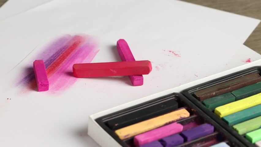 Set of colorful chalk pastels on table, closeup