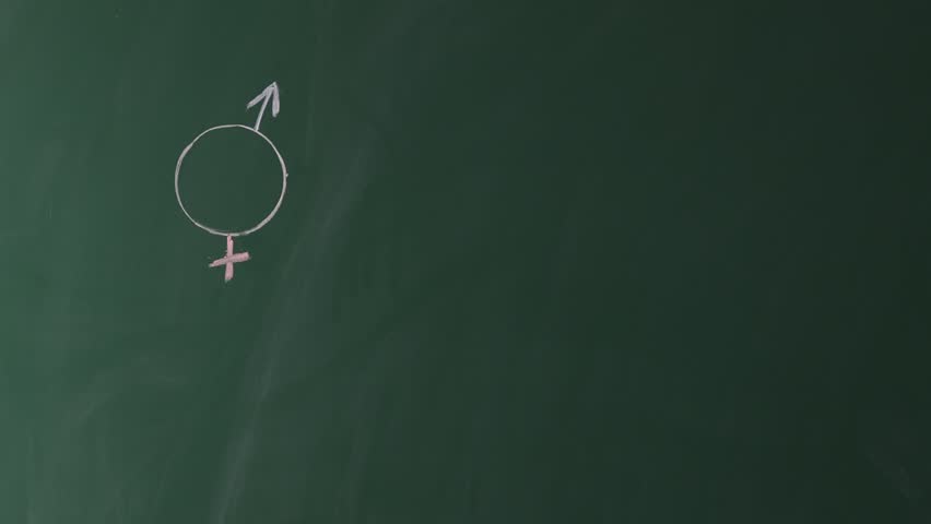 Woman writing word Sex Education on green chalkboard, closeup