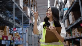 Asian woman warehouse worker in uniform doing stocktaking of products management in cardboard box on shelves in warehouse using clipboard file and pen, logistic and business export	 - Powered by Shutterstock - Get 15% off with code: PIKWIZARD15