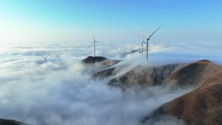 Majestic Mountain Sea of Clouds with Wind Turbines 4K Aerial