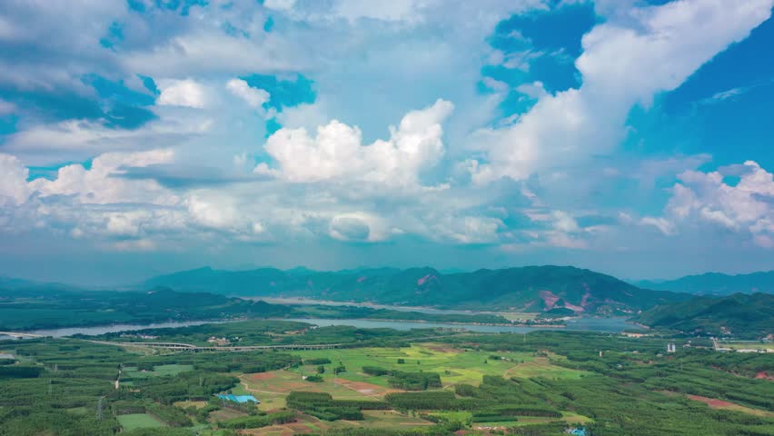 Grand Landscape of Distant Mountains Rural Village Under Blue Sky
