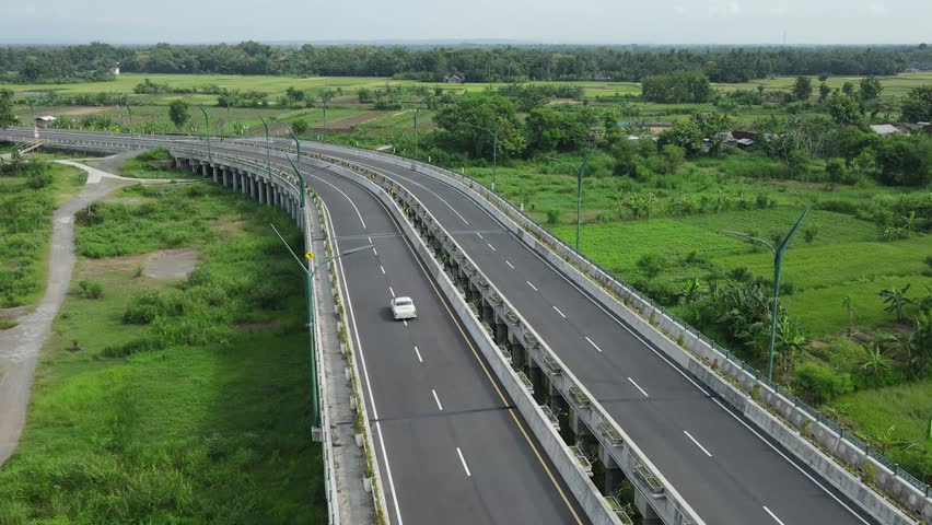 Aerial View Car on Modern Highway Bridge with Rural Landscape.