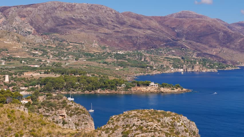 Stunning Sicily shoreline with hills; calm, serene outdoor view