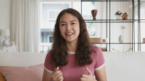 Device screen social media live talk look at camera chat app Gen Z asian. Young adult woman asia people teen happy smile advice work at home sit sofa selfie viral video call webcam online class tutor. - Powered by Shutterstock - Get 15% off with code: PIKWIZARD15