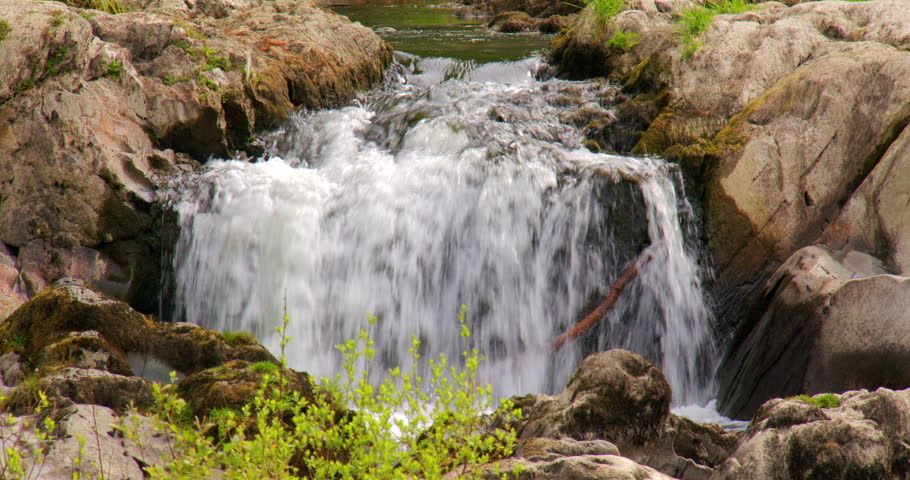 Close up shot of a small waterfall at Cenarth falls on the river Teifi.