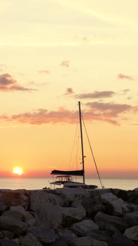Sailboat at sunset in Cinque Terre, Italy, calm and peaceful scenery