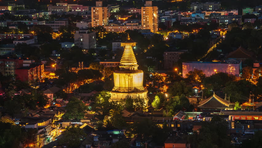 The White Pagoda of Miaoying Temple in Beijing, China, under the night sky