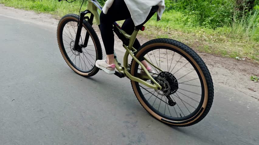 Cyclist Riding Modern Mountain Bike On Forest Trail. Showing Speed, Strength And Control During Outdoor Training. Motion Energy And Determination. Endurance Adventure. Active Recreation Sport Activity