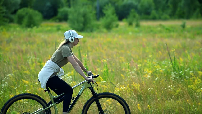 Cyclist Riding Modern Mountain Bike On Forest Trail. Showing Speed, Strength And Control During Outdoor Training. Motion Energy And Determination. Endurance Adventure. Active Recreation Sport Activity