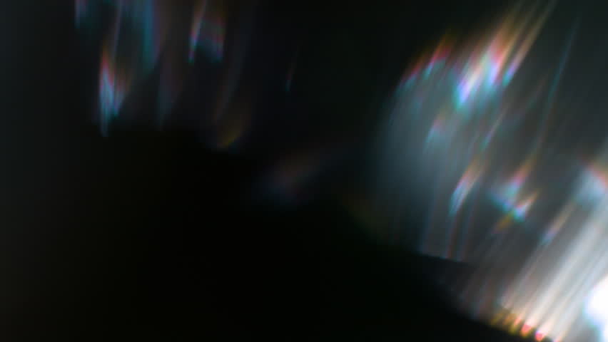 Real Shooted Cinematic Lens Flare Overlay on Black Background at 1000fps Slow Motion.