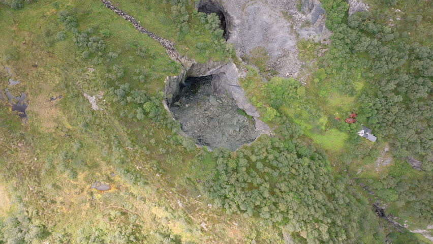 Aerial footage of deserted lime mines in the Norwegian wilderness, with rugged cliffs and dramatic natural surroundings