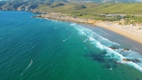 Aerial descendig view over Guincho beach where we see windsurfers taking advantage of an excellent windy day to practice sports, Cascais,Portugal - Powered by Shutterstock - Get 15% off with code: PIKWIZARD15