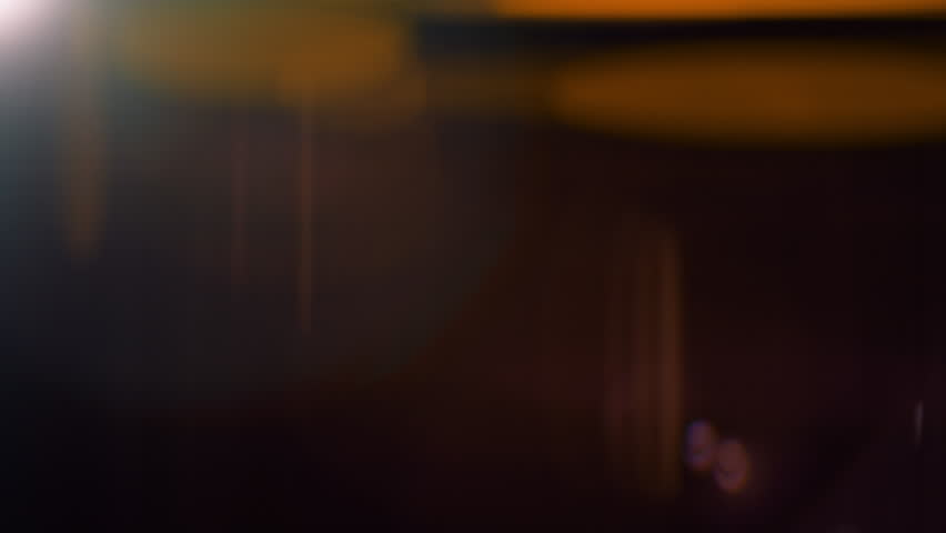 Real Shooted Cinematic Lens Flare Overlay on Black Background at 1000fps Slow Motion.