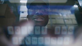 POV from Phone Screen: African American Employee Using Smartphone, Scrolling and Chatting in Social Networks. In the Background, Diverse Loaders Working in Logistics Distribution Warehouse at Night. - Powered by Shutterstock - Get 15% off with code: PIKWIZARD15