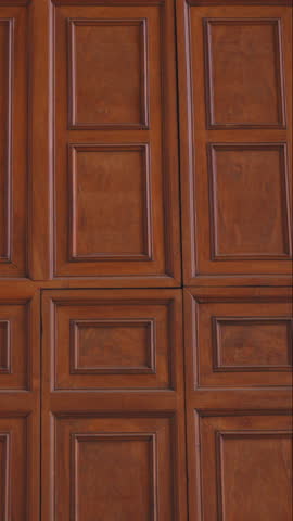 Wooden coffered panel detail in neoclassical interior design with warm natural grain and traditional craftsmanship