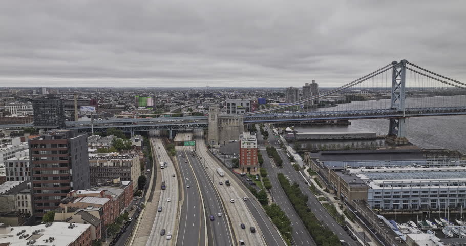 Philadelphia Pennsylvania Aerial v210 flyover Old City capturing freeway traffic, Benjamin Franklin Bridge over Delaware River and cityscape of Camden NJ - Shot with Mavic 3 Pro Cine - Sept 29th 2023