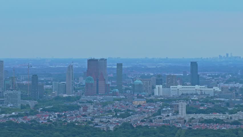 Aerial drone view of The Hague city skyline with tall skyscrapers, Netherlands