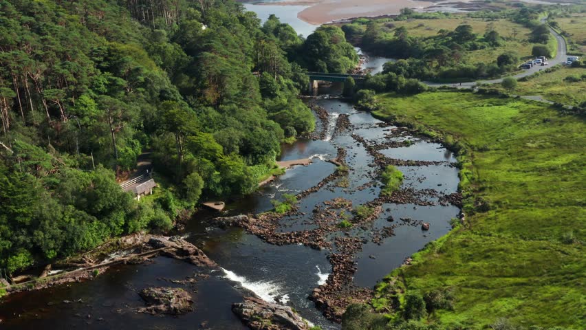 Aerial Orbit of Aasleagh Falls with River, Rocks, and Forest in Scenic Connemara, Ireland