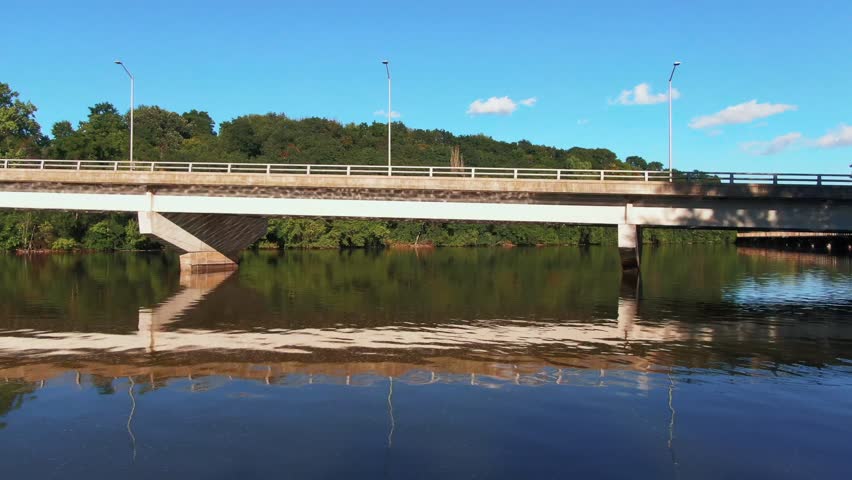 Drone Shot Passing Under Bridge on Fox River in Appleton, Wisconsin