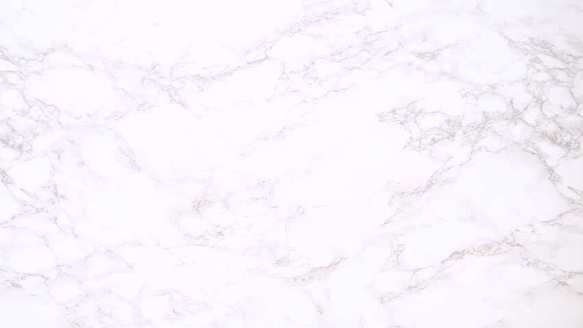 Turquoise speckled baking tray sits empty on a marble countertop. Useful for video transitions, baking intros, or copy space for food-related content.